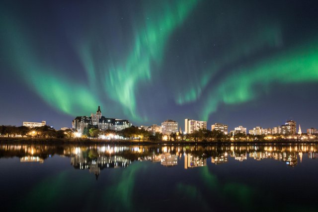 northern lights above Saskatoon city downtown