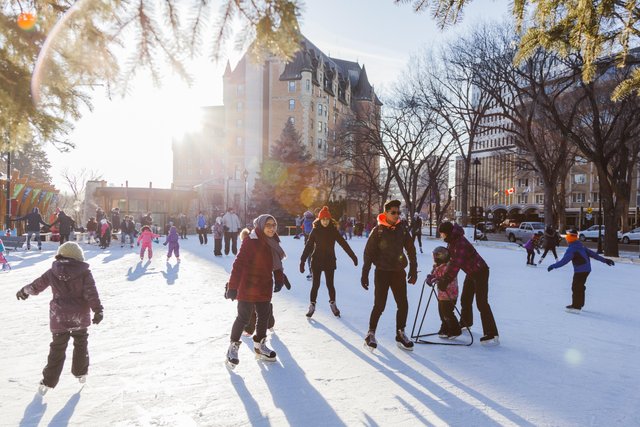 people skating on an outdoor skating rink